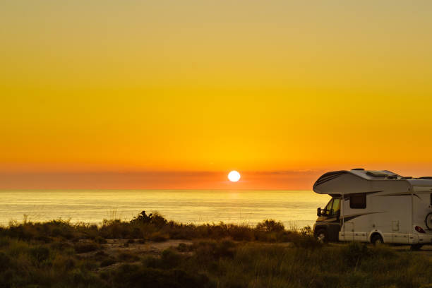 istock Caravan on sea at sunrise. 1498940173