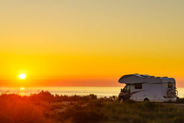 istock Caravan on sea at sunrise. 1498940219