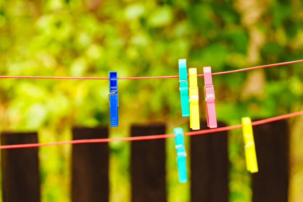 istock Clothes pegs on line outdoor. Housework 1498942733