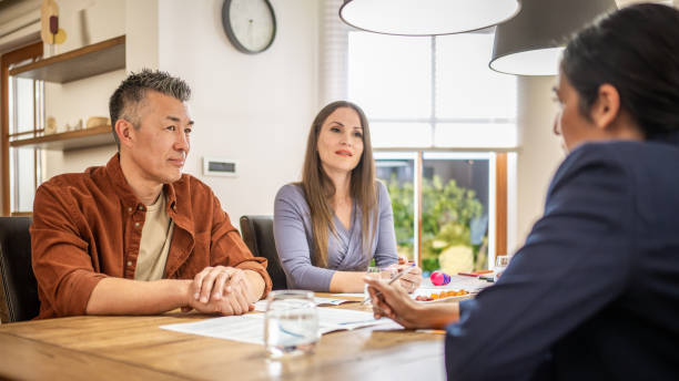 istock Real estate agent explaining leasing agreement to clients 1498944292