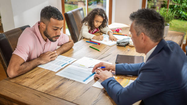 istock Real estate agent explaining mortgage agreement to client 1498944298
