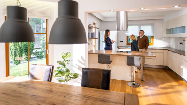 istock Senior couple checking kitchen at real estate showing 1498944316