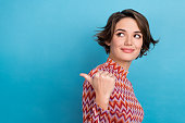 Closeup photo lady indicate finger empty space mockup billboard interesting news wear print shirt isolated blue color background