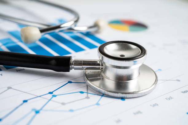 istock Stethoscope on graph paper, Finance, Account, Statistics, Investment, Analytic research data economy and Business company concept. 1498949296