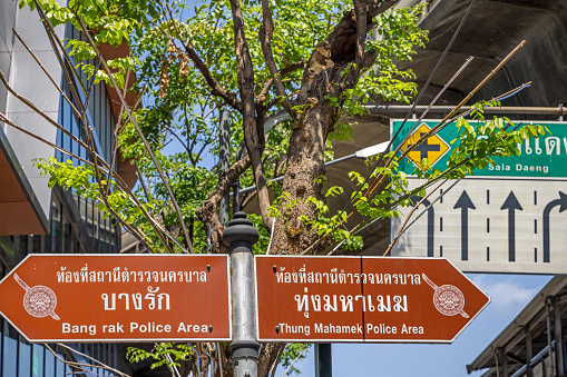 Bangkok, Thailand - March 26th 2023: Sign marking the boundary between two police districts in a street in the center of the Thai capital
