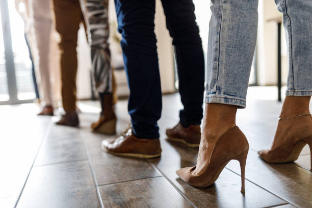 istock Group of unrecognizable people standing in line and waiting 1498955487