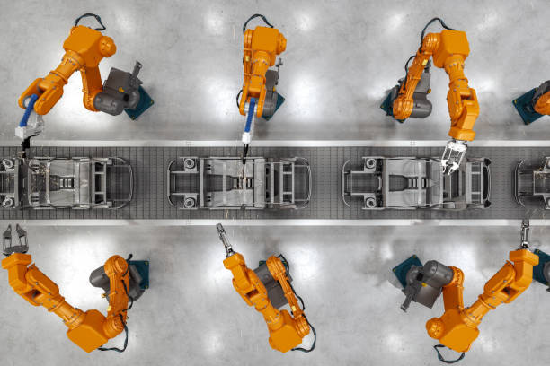 Industrial Robots At The Automatic Car Manufacturing Factory Assembly Line Top view of industrial welding robots at the automated car manufacturing factory assembly line. car plant stock pictures, royalty-free photos & images