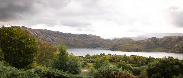 A landscape shot of Loch Torridon in the Scottish highlands. It is an overcast day with no people in the shot.