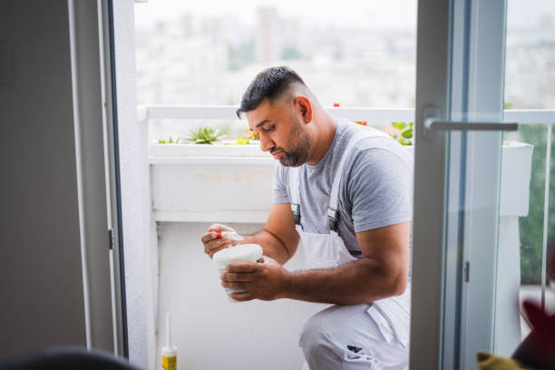 Handyman about to paint the balcony