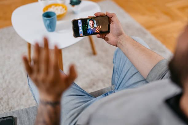 istock Talking To A Friend On A Video Call While Sitting At Home 1498959273