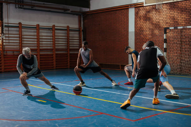 istock Diverse basketball players stretching. 1498967381