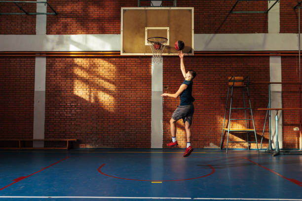 istock Man scoring point at basketball practice. 1498968745