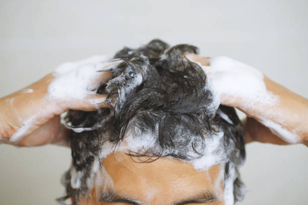 istock A man is washing his hair with shampoo 1498969556