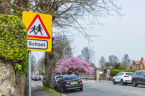 Eastbourne, England - April 30, 2023: School children crossing sign
