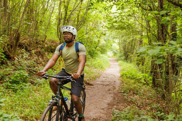 istock A Cyclist Rides A Bicycle In A Mountain Forest 1498971477