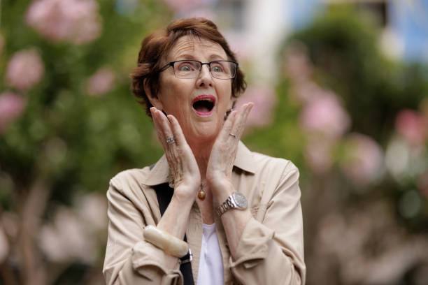 istock Surprised woman outdoors looking off-camera. 1498978134