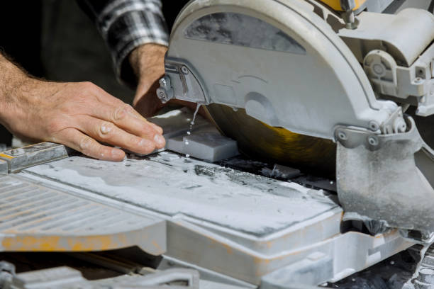 istock Using circular diamond blades for cutting ceramic tile on a wet saw 1498981404