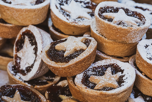 Piles of delicious ( personally sampled ) artisan Christmas mince pies at Bath Christmas market.