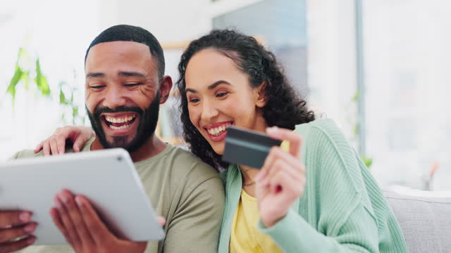 Laughing, payment and couple with a tablet and credit card for banking, ecommerce and online shopping. Happy, buying and a man and woman speaking about an order on an app, purchase and bills