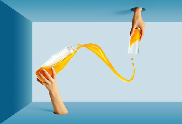 Refreshing drinks. Female hand sticking out from circle hole with bottle pouring juice into glass. Health, freshness and creativity art concept.