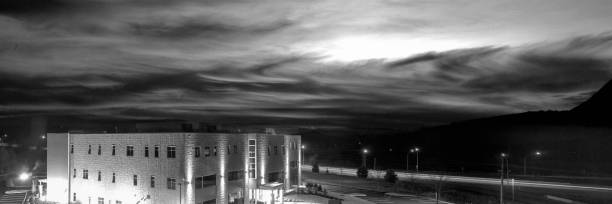 istock Dramatic stormy cloudscape over industrial buildings along the highway 1498984994