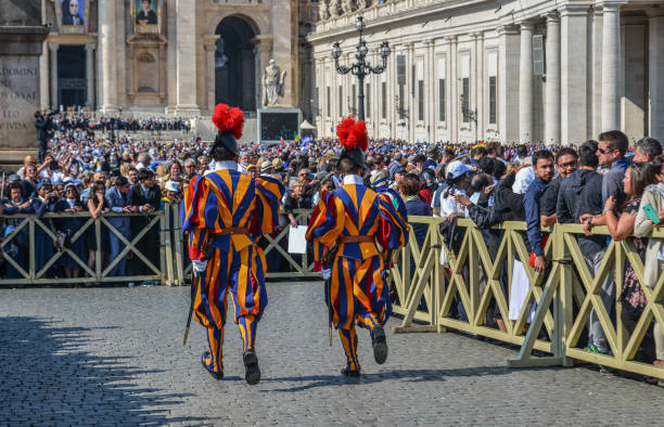 Vatican - Oct 14, 2018. Papal Swiss Guard in uniform at Saint Peter Square. Swiss soldiers are a symbol of attraction in Vatican.