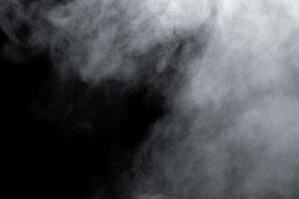 istock white smoke isolated, abstract powder, water spray on black background. 1498988920