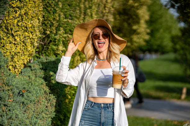 istock Woman having fun in the park on a sunny day 1498990626
