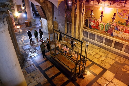 People visit the Church of the Holy Sepulchre in Christian Quarter of Jerusalem Old City. It is part of Jerusalem's UNESCO World Heritage Site.
