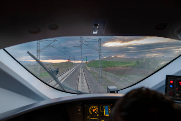 istock Motion blur view of railway from inside high speed train at evening and control panel of the locomotive 1498992173