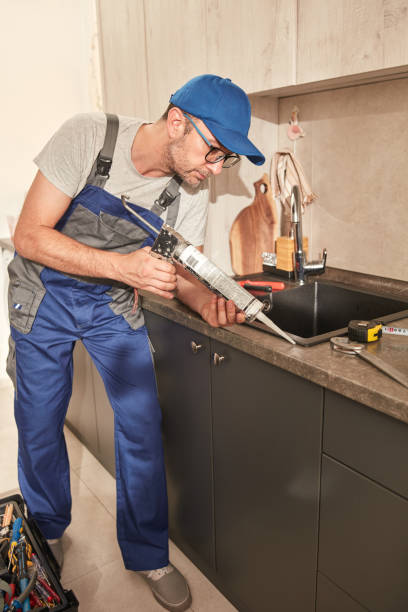 istock Handyman fixing kitchen cabinets in the apartment. 1498992631
