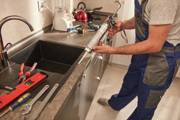 istock Handyman fixing kitchen cabinets in the apartment. 1498992679