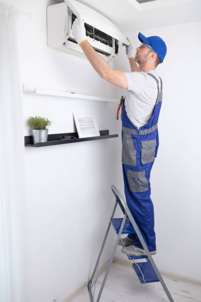 istock Service guy cleaning and maintaining air condition unit. 1498994042