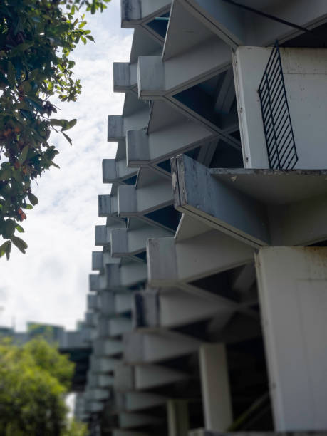 istock Green tree park area apartment building 1498995355