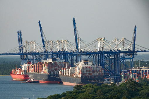 Charleston, South Carolina, USA- May 24, 2021: Container ships and cranes. Port of Charleston, South Carolina.
