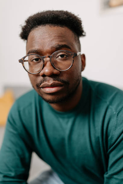istock African American Man Battling Depression Seeks Comfort on a Sofa 1498998445