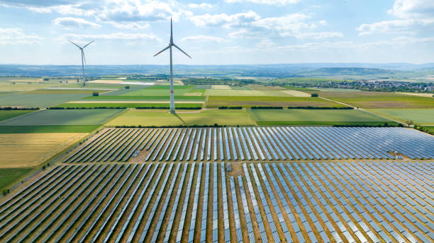 istock Wind turbines and solar park - aerial view 1499000643