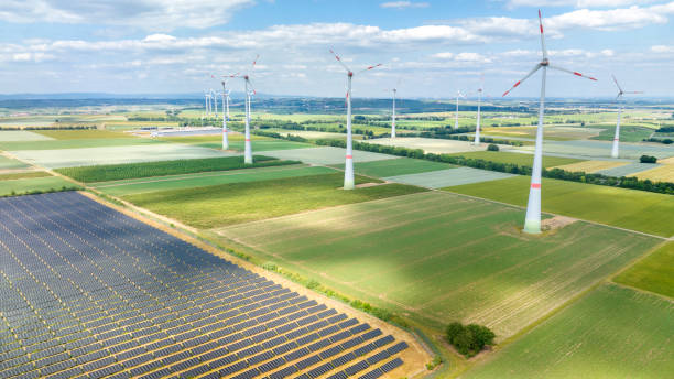 istock Wind turbines and solar park - aerial view 1499000666