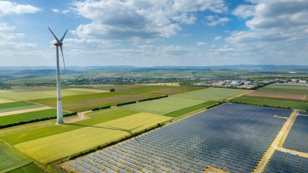 istock Wind turbines and solar park - aerial view 1499000719