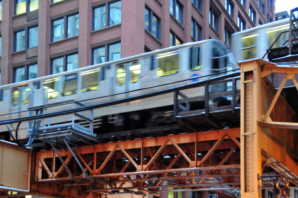 The L train subway line in Chicago blurry motion with apartments in background