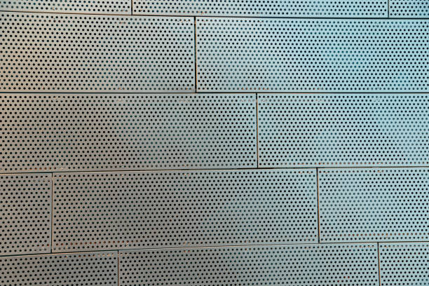 Metal Perforated Wall Tiles of contemporary building. Facade Wall. Construction, archetecture texture