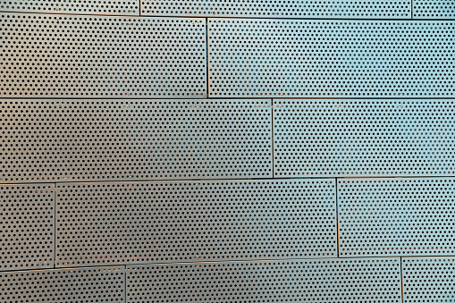 Metal Perforated Wall Tiles of contemporary building. Facade Wall. Construction, archetecture texture