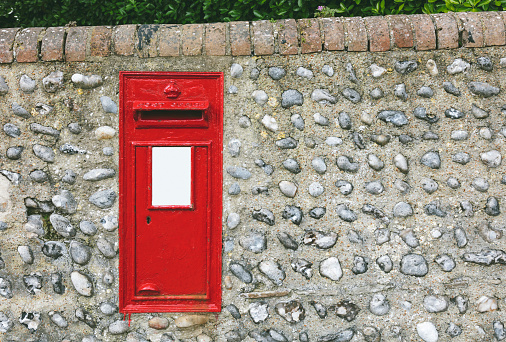 Traditional old Red British post box  in the UK