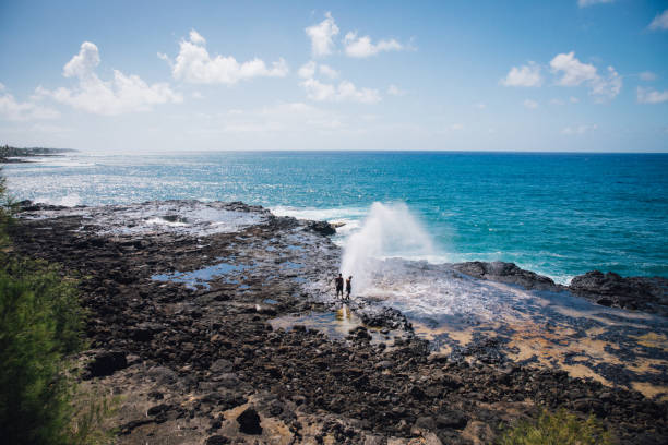 watching the blowhole erupt in Kauai on a sunny bright day