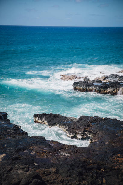 watching the blowhole erupt in Kauai on a sunny bright day