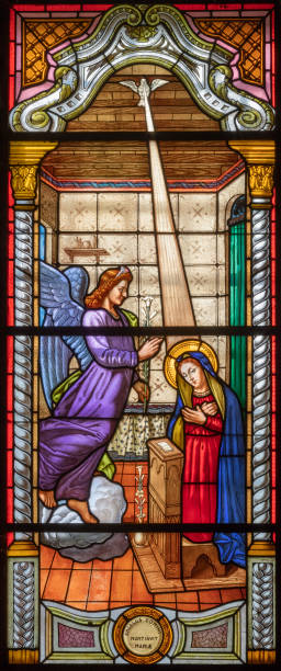 Alagna - The Annunciation in the stained glass of church  San Giovanni Battista Alagna - The Annunciation in the stained glass of church  San Giovanni Battista by O. Janni from end of 19. cent. roberto alagna stock pictures, royalty-free photos & images