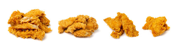 istock Chicken Strips Isolated, Breaded Nuggets, Crispy Fry Chicken Meat, American Deep Fried Crunchy Fillet Pieces 1499015316