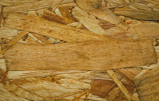 sfondo della trama del truciolato, modello del pannello osb marrone chiaro, sfondo dei trucioli di legno incollati pressati - particle plank wood brown foto e immagini stock