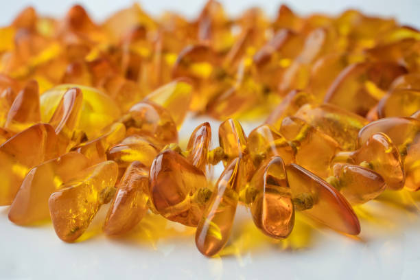 Macro close up of amber necklace on white background