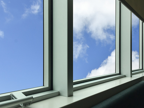 Modern metallic window frame with sky background, new modern window frame with sky background